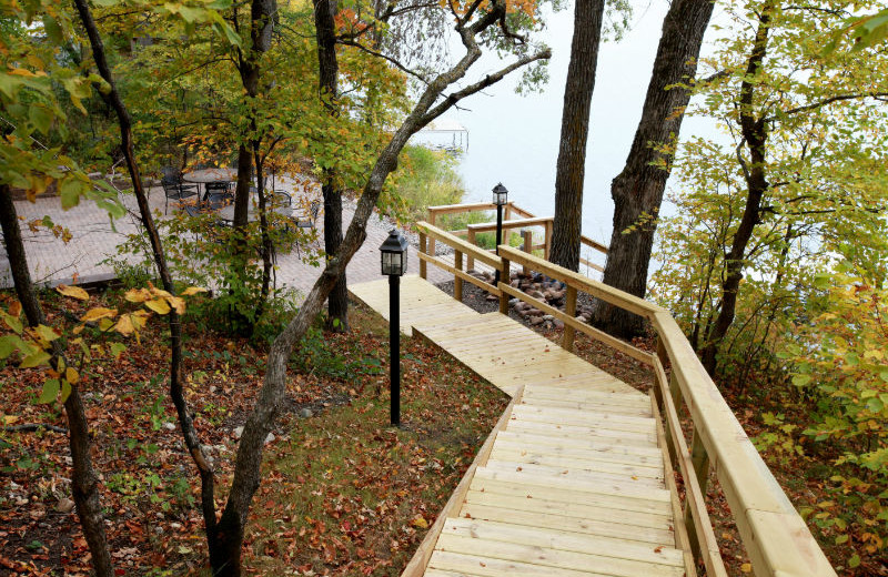 Stairway to patio viewing the lake at East Silent Lake Vacation Homes.