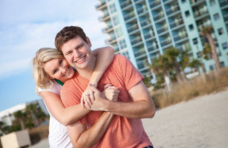 Couple on beach at Bay View Resort.