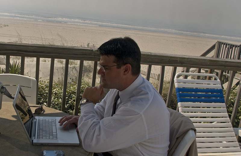 Working on the balcony at Ocean Isle Inn.