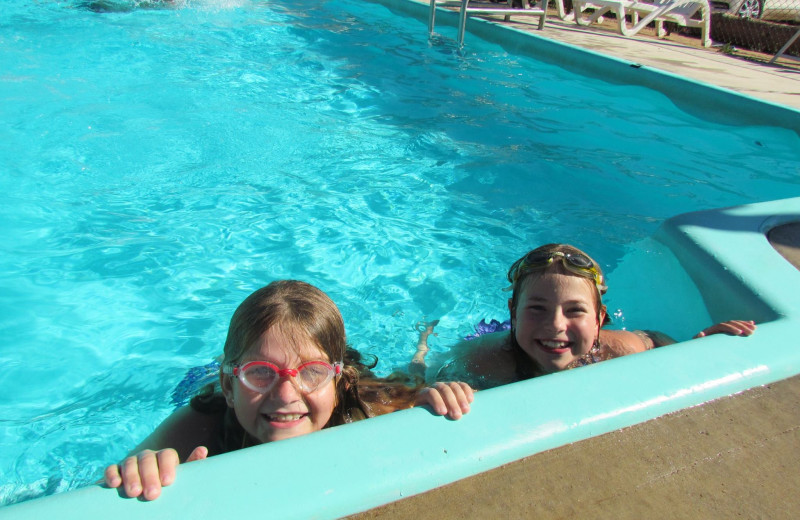 Kids swimming at High Country Guest Ranch.