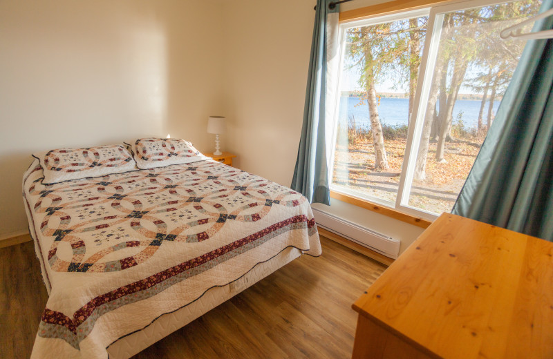 Cottage bedroom at Scotsman Point Cottage Resort. 