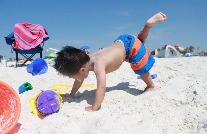 Playing on the beach at Sunset Properties.