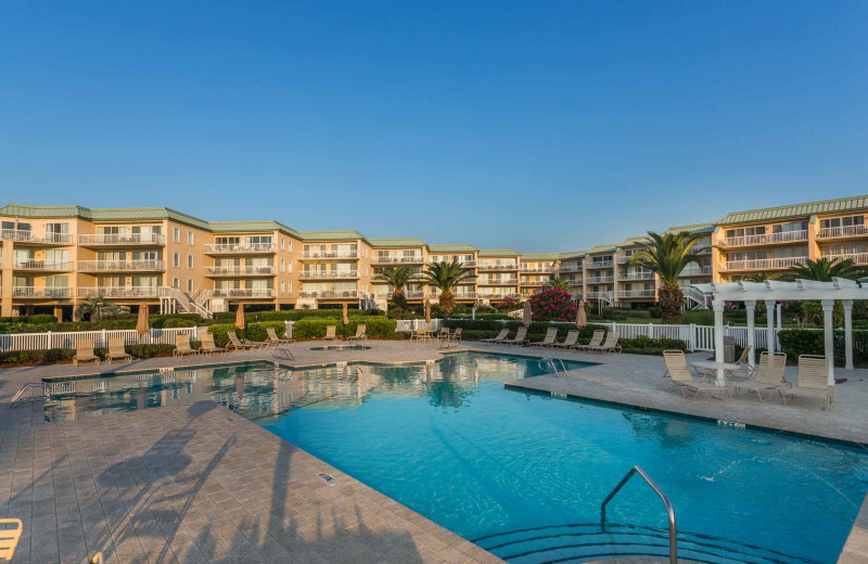 Outdoor pool at Real Escapes Properties - St. Simons Grand 224.