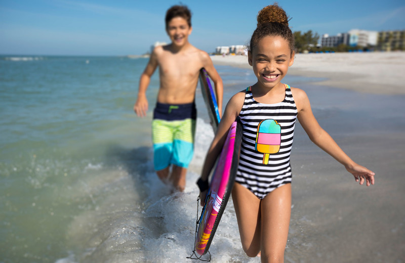 Kids on beach at TradeWinds Island Grand.