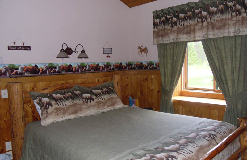 Cabin bedroom at Glaciers' Mountain Resort.