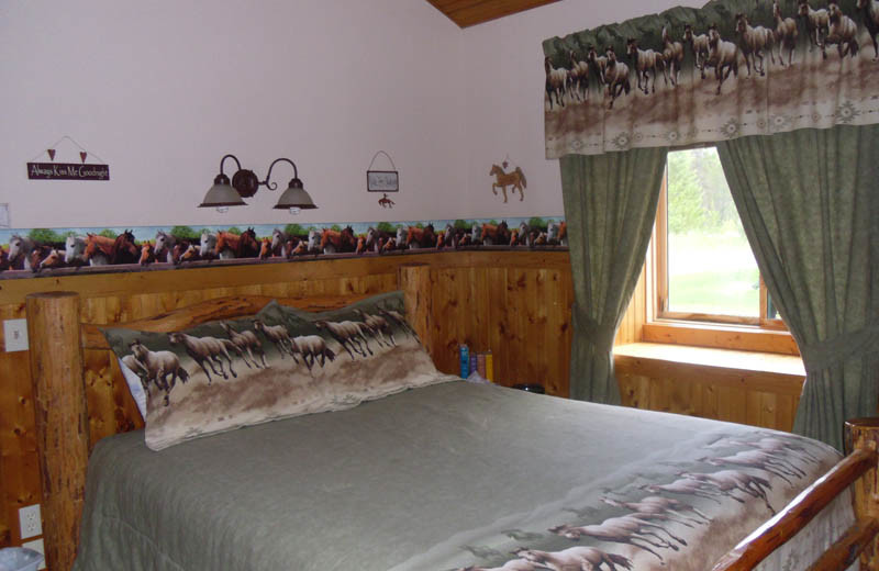 Cabin bedroom at Glaciers' Mountain Resort.