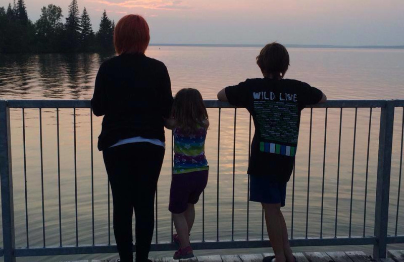 Family looking at lake at The Cottages At Clear Lake.