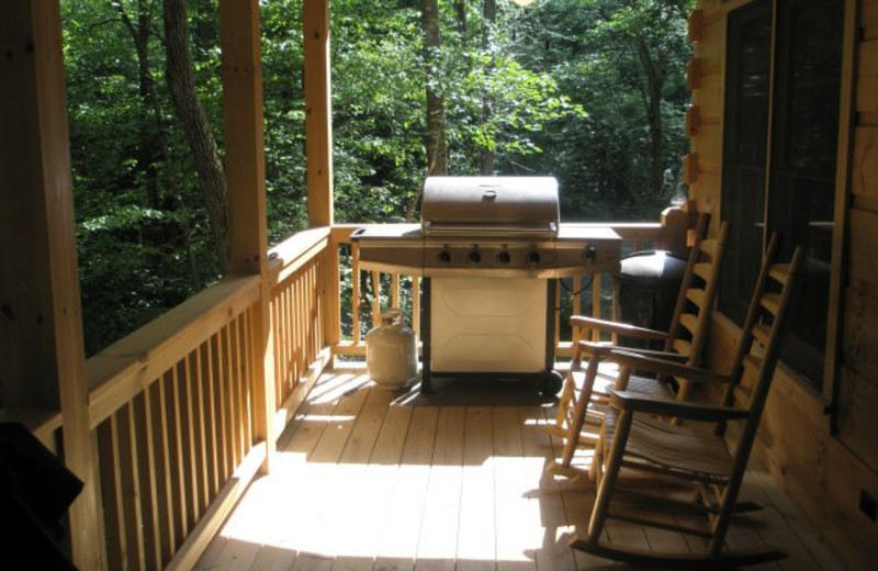 Cabin deck with BBQ at Avenair Mountain Cabins.