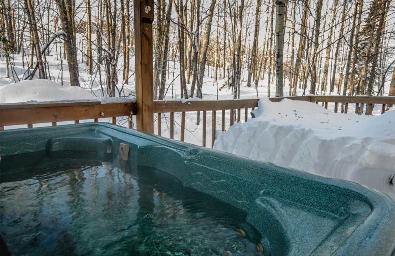 Cabin hot tub at Big Powderhorn Lodging Association.