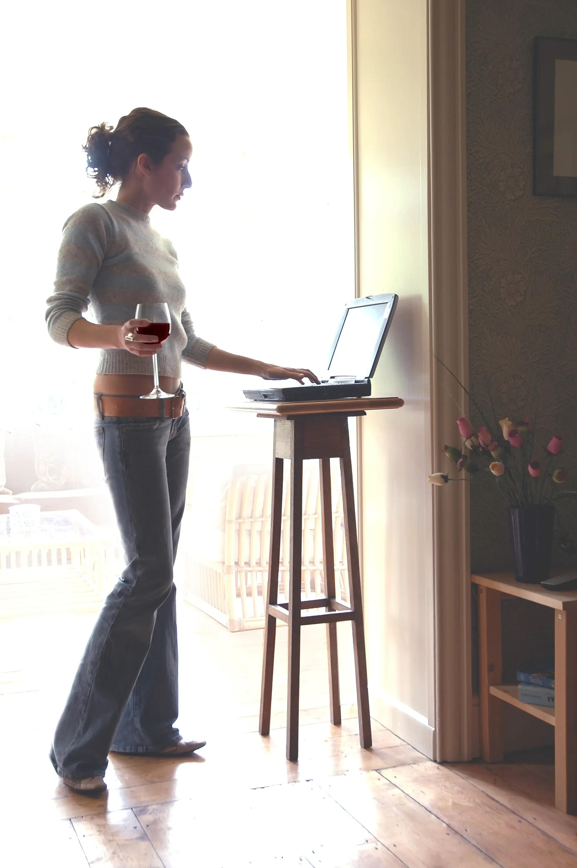 Lady making online reservation at home.