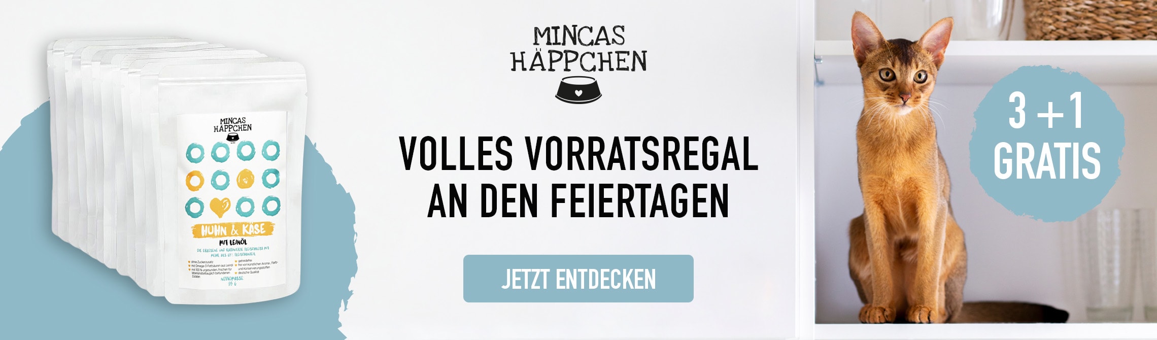 Abissinierkatze rechts mit 3 + 1 Gratis Schriftzug, Pouchbeutel links, Mincas Häppchen Logo + "Jetzt Entdecken"-Button mittig