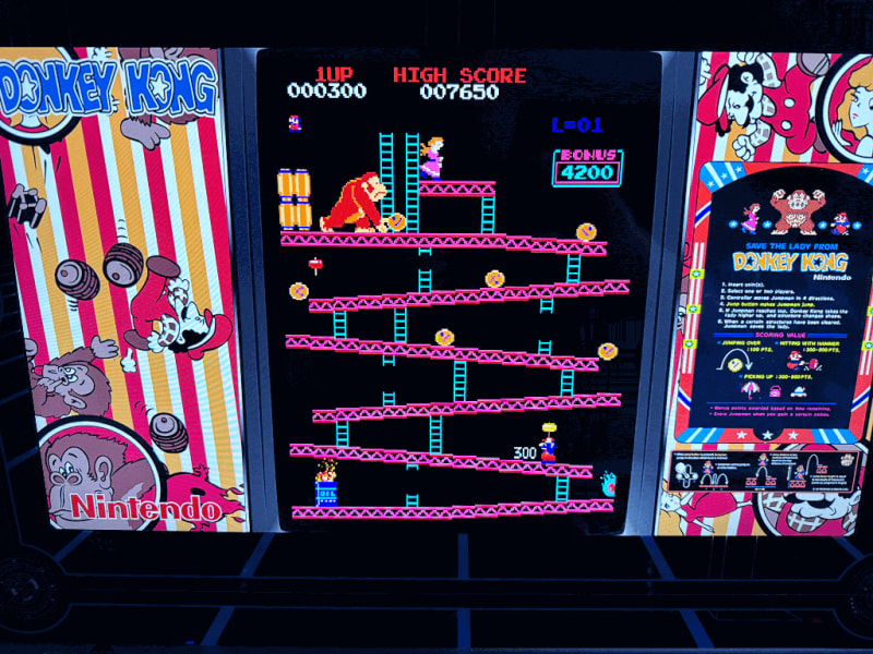 Donkey Kong A close up of an arcade playing the Donkey Kong arcade game.