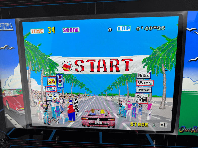 Outrun A close up of an arcade playing the Outrun arcade game.