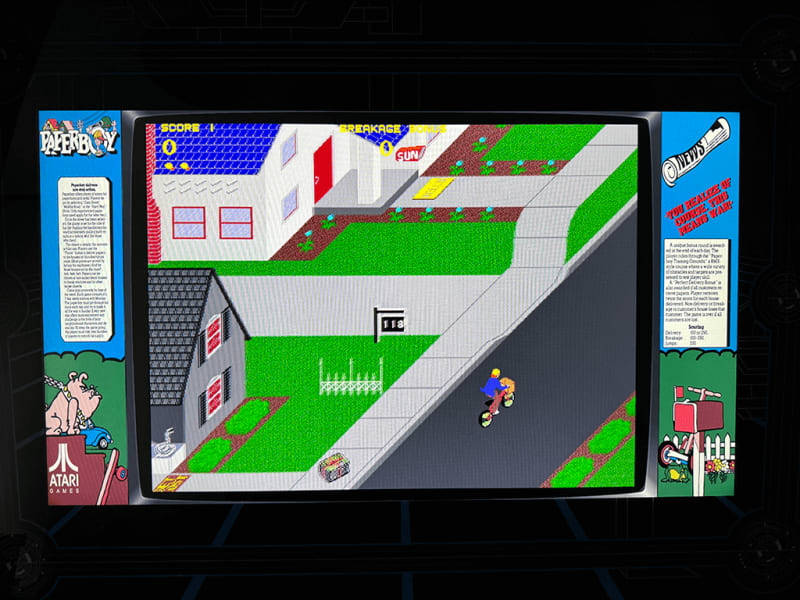 Paperboy A close up of an arcade playing the Paperboy arcade game.