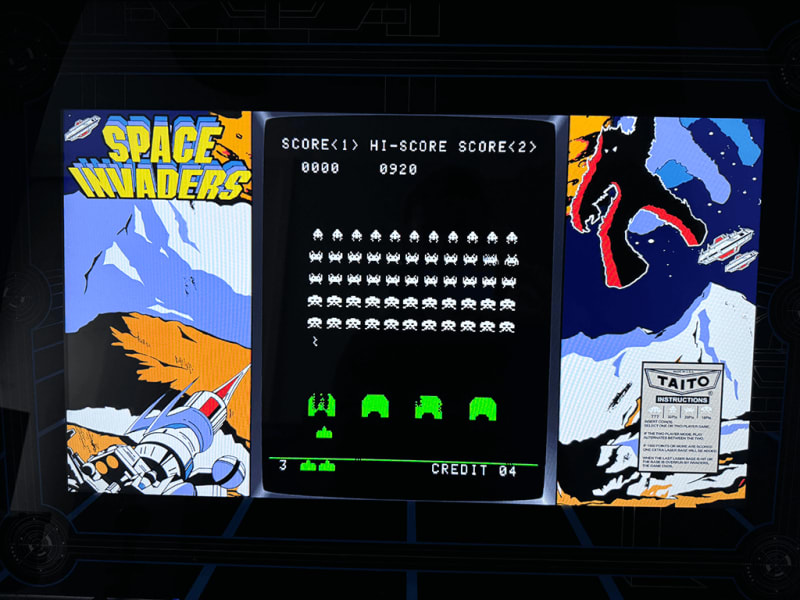 Space Invaders A close up of an arcade playing the Space Invaders arcade game