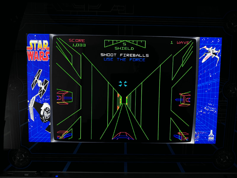 Star Wars A close up of an arcade playing the Star Wars arcade game.