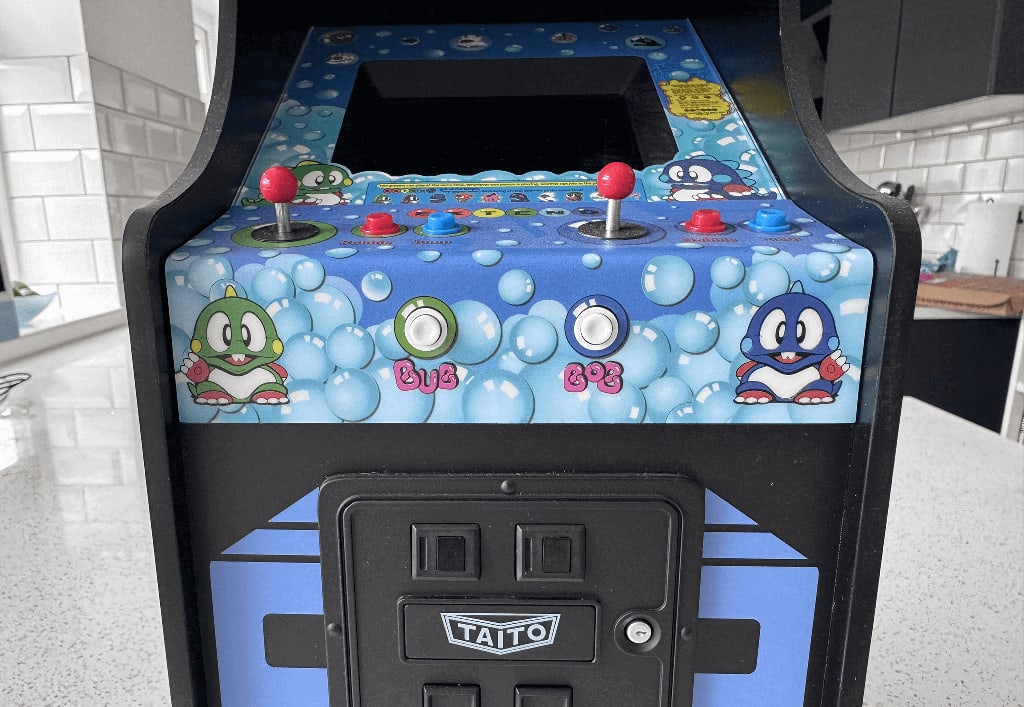 Bubble Bobble A Bubble Bobble quarter arcade cabinet on a quartz worktop surface in a kitchen.