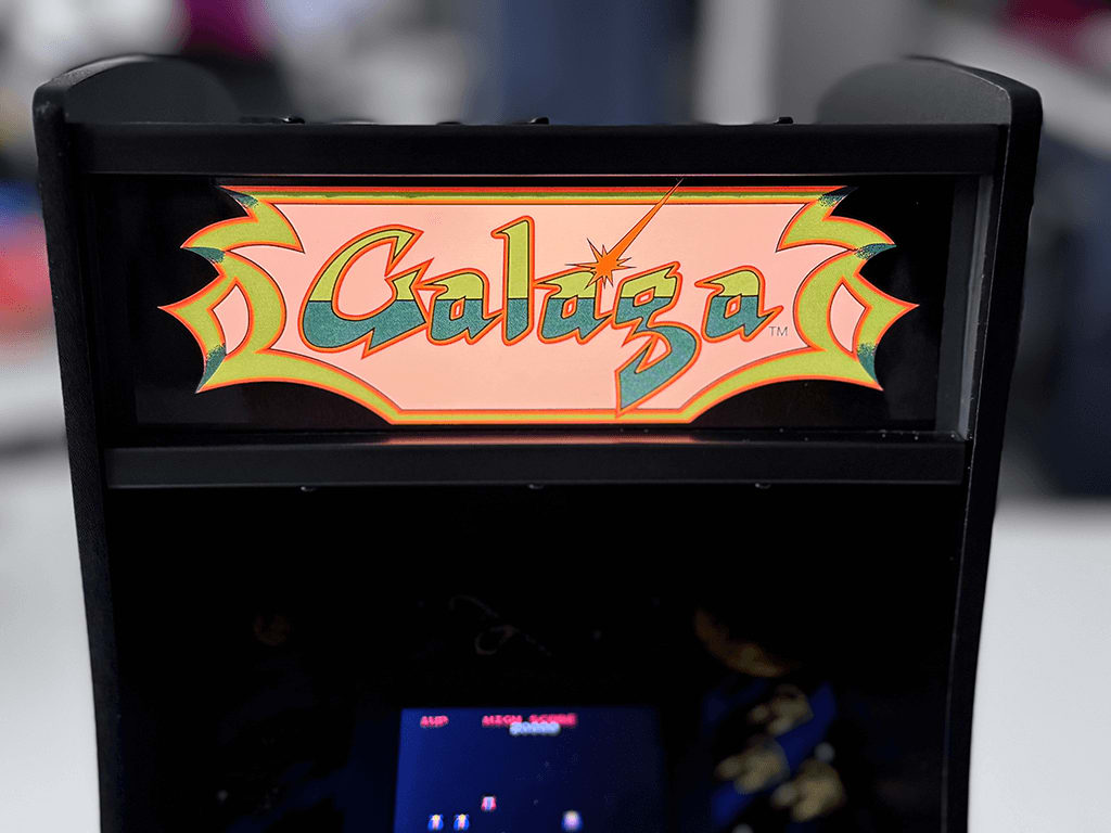 Galaga A Galaga Quarter Arcade close up showing a lit Marquee and game playing.