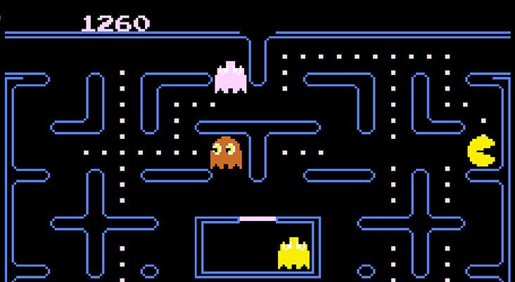 Close-up of someone playing the Atari Game Station Go handheld.