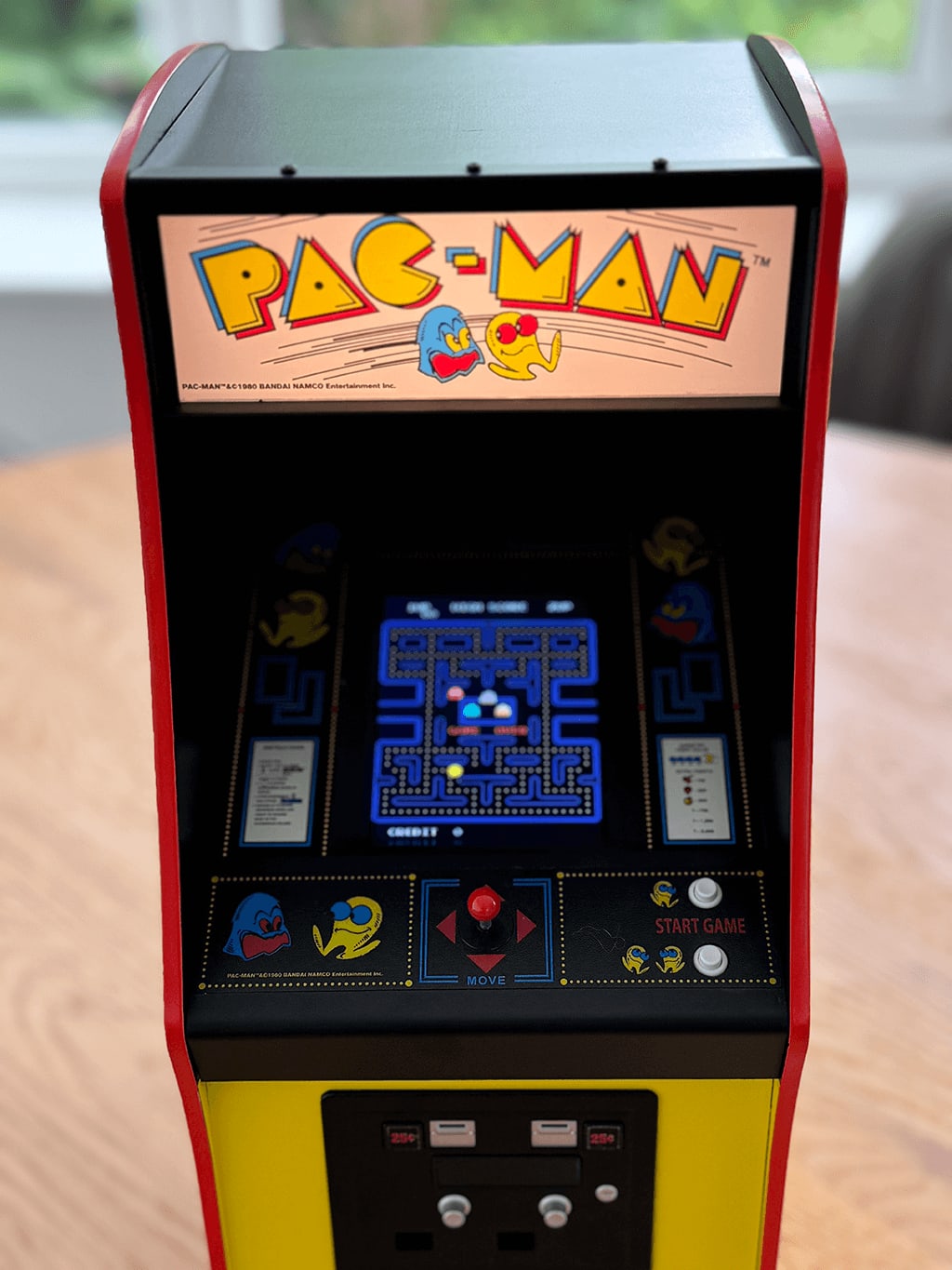PAC-MAN 5 A PAC-MAN Quarter Arcade front view showing the orginal PAC-MAN ROM playing.