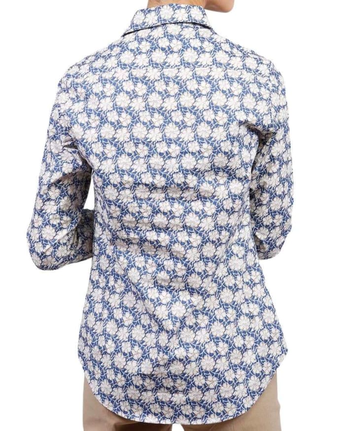 a person's back with a floral shirt