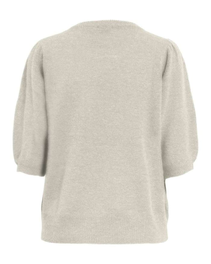 a white sweater on a mannequin