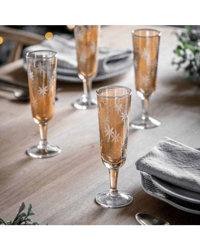 a group of champagne glasses on a table