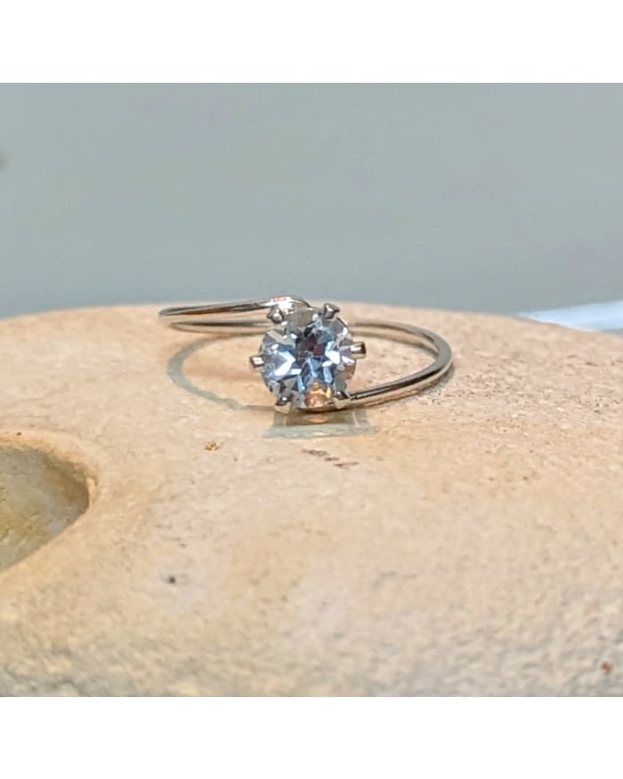 a diamond ring on a rock