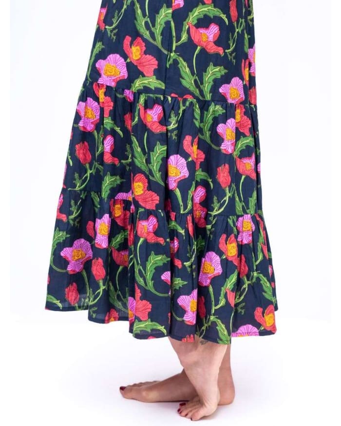 a woman wearing a floral skirt