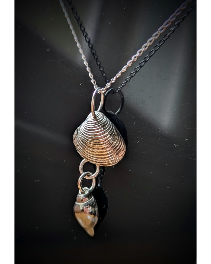 a necklace with a shell pendant