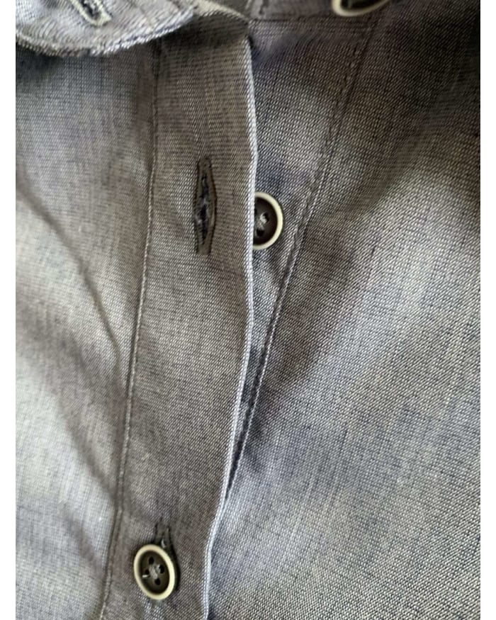 a close up of a button on a shirt