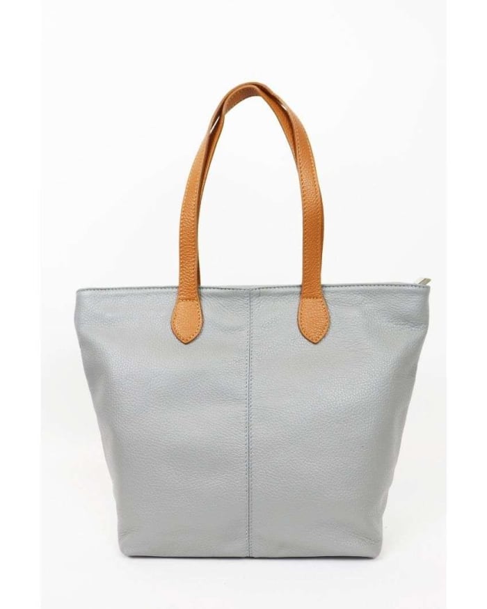 a grey leather bag with brown handles