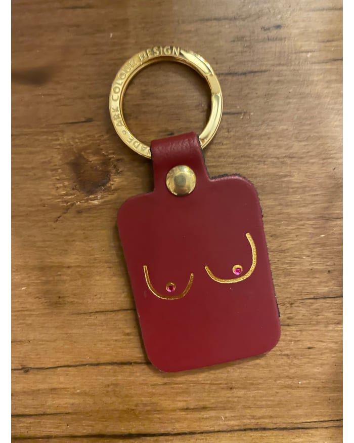 a red key chain with a gold ring and a red square with a gold ring and a gold ring with a gold ring with a gold ring with a gold ring with a gold ring with a gold