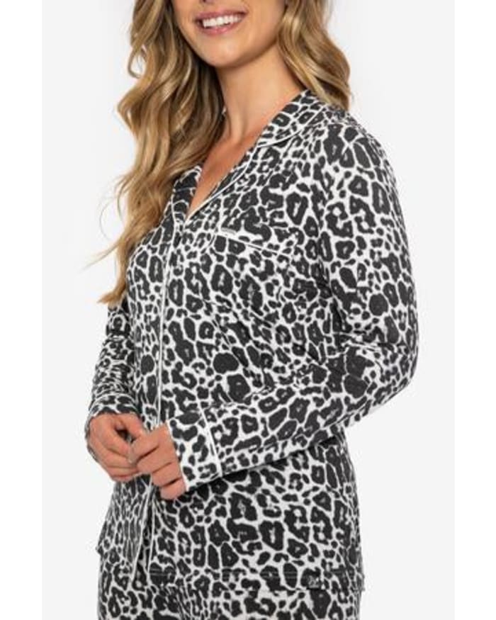 a woman in a leopard print pajamas