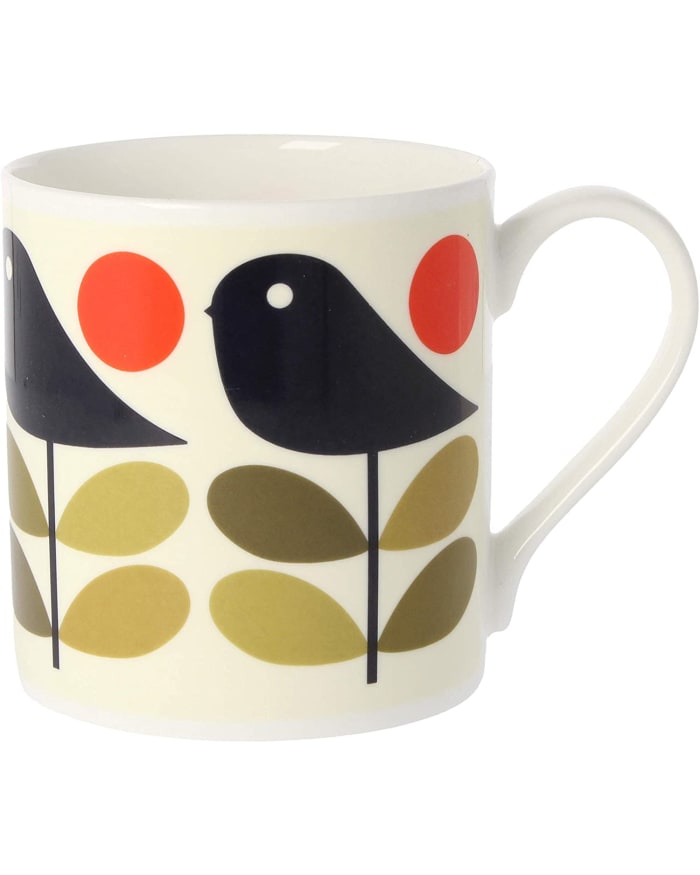 a white mug with a bird design on it