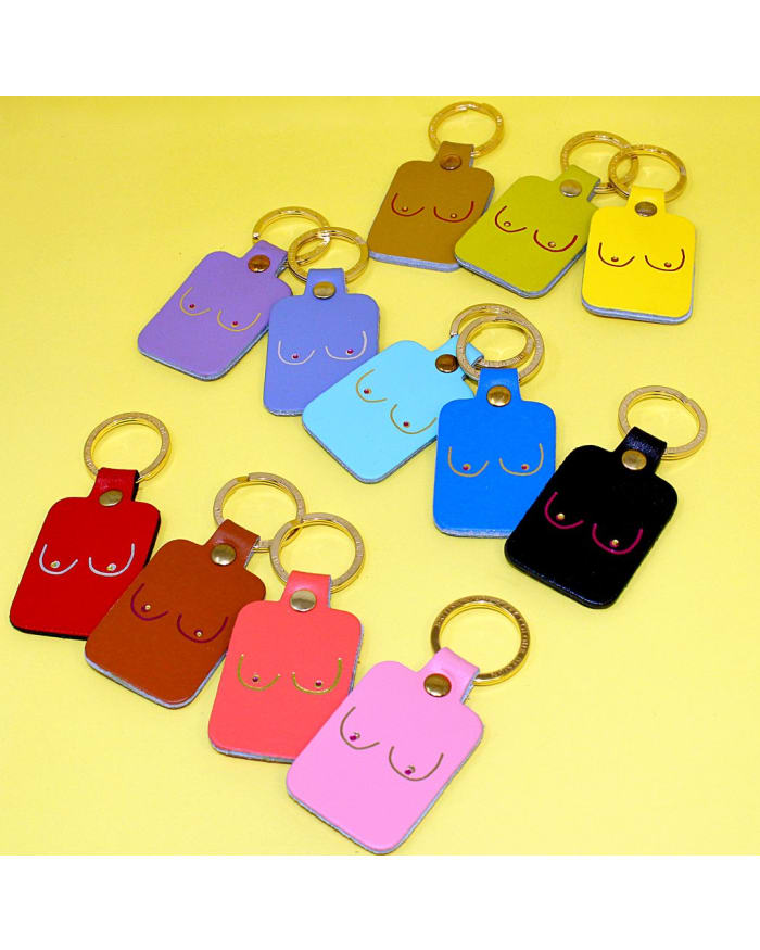 a group of keychains with different colors of shapes