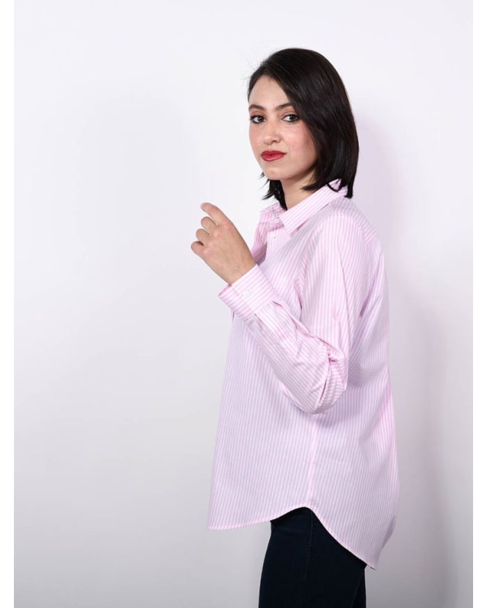 a woman in a pink and white striped shirt