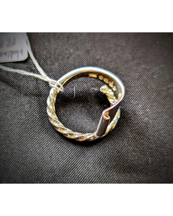 a silver ring with a string