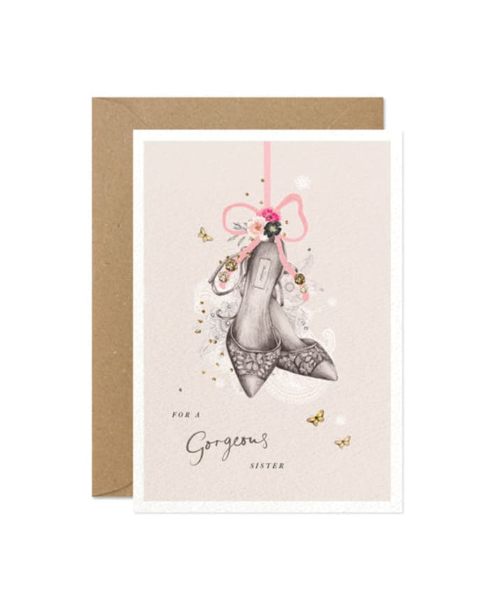 a card with a drawing of shoes and flowers