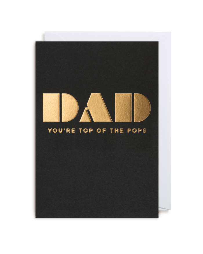 a black and gold card with white envelope