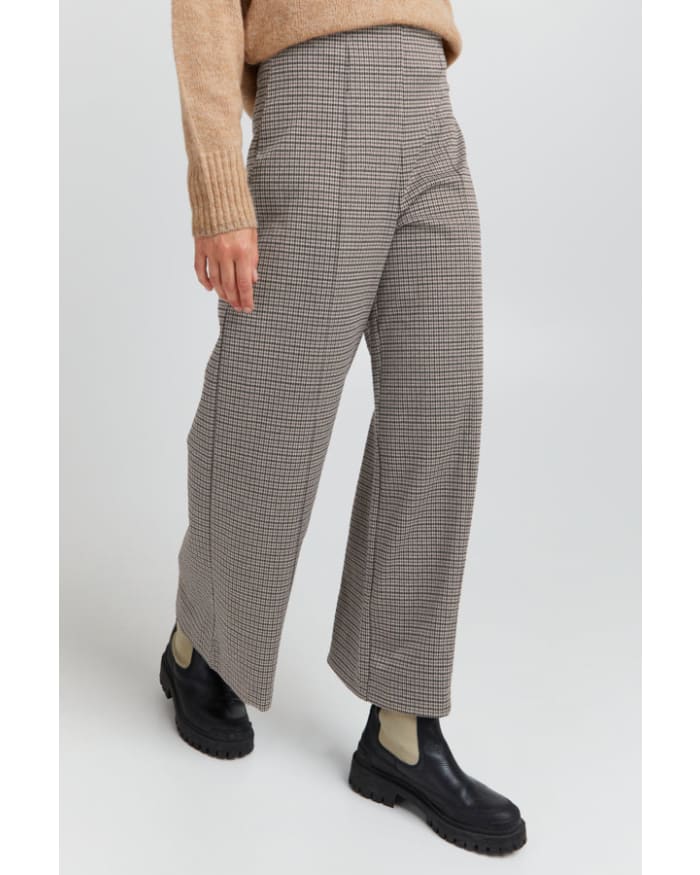 a person wearing a plaid pants