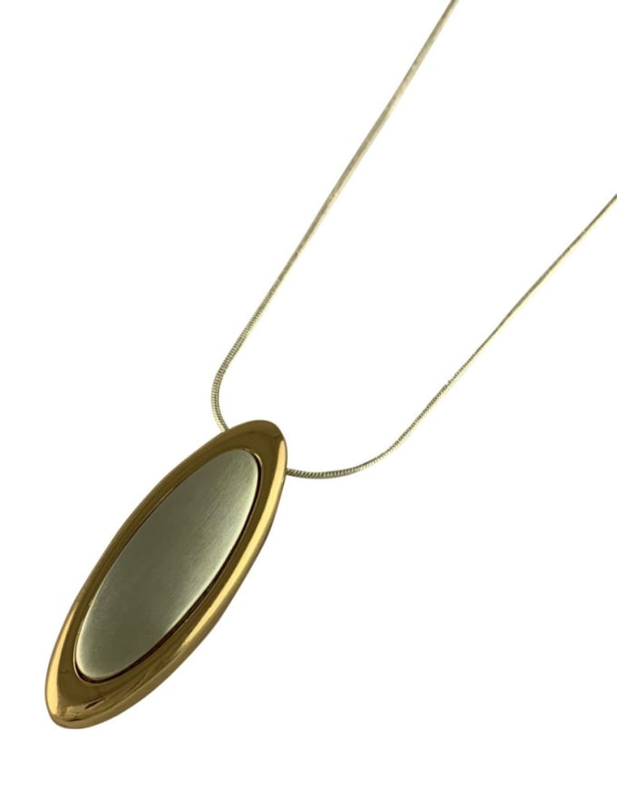 a gold oval necklace with a gold oval pendant