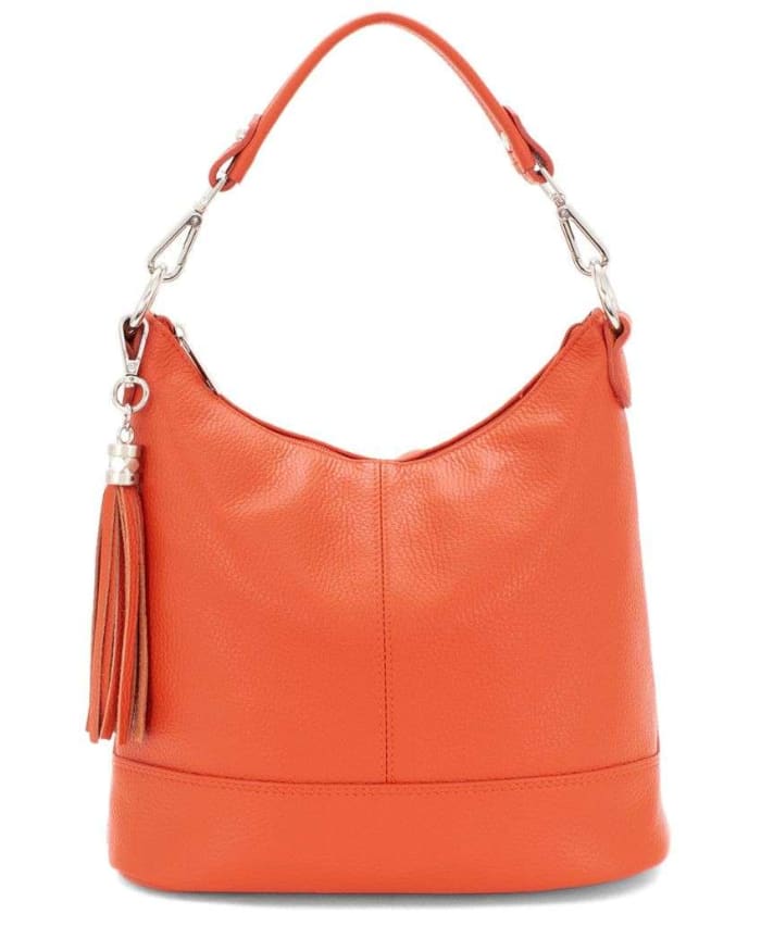 an orange leather purse with a tassel