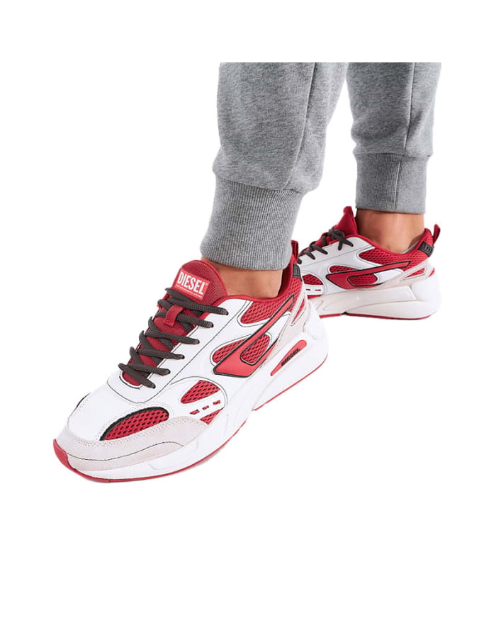 a person wearing red and white sneakers