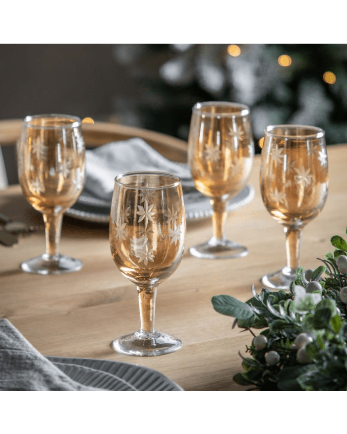 a group of wine glasses on a table