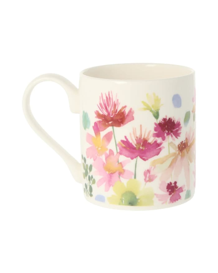 a white mug with a floral design