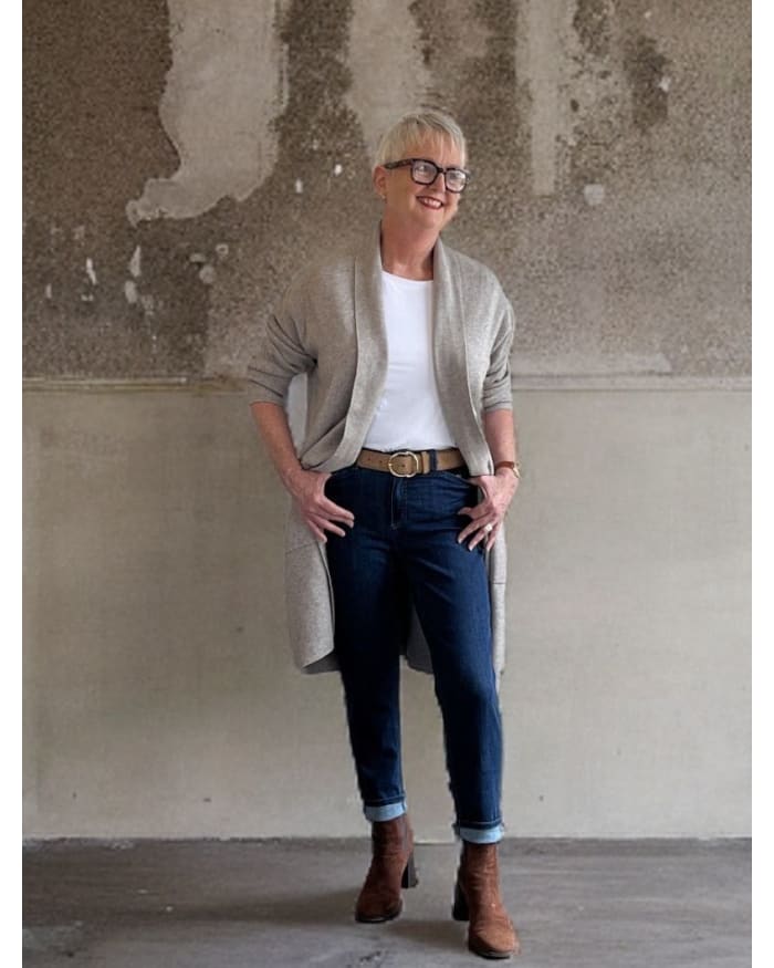 a woman standing in front of a wall