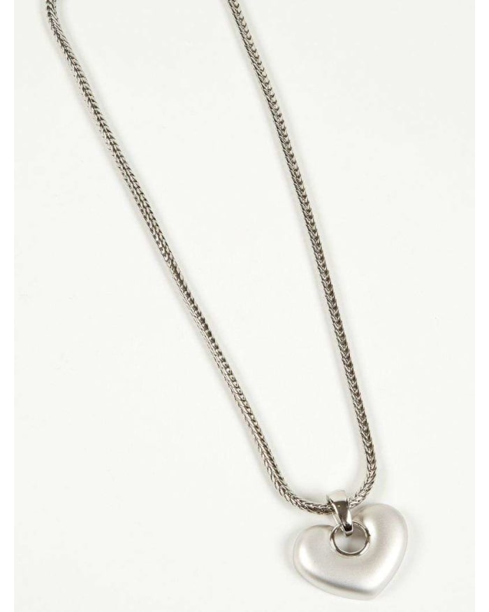 a silver heart necklace on a white background