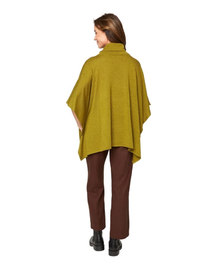 a woman in a green sweater