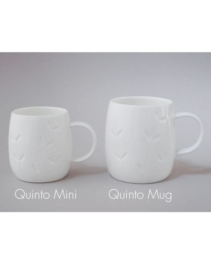 two white mugs with text